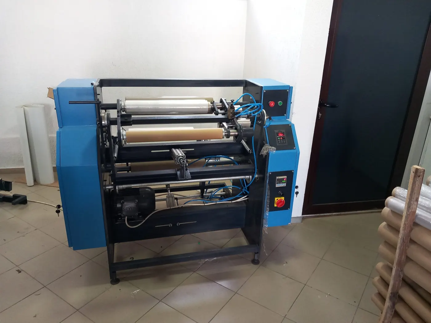 Simform stretch film rewinding machine, blue housing with the control panel