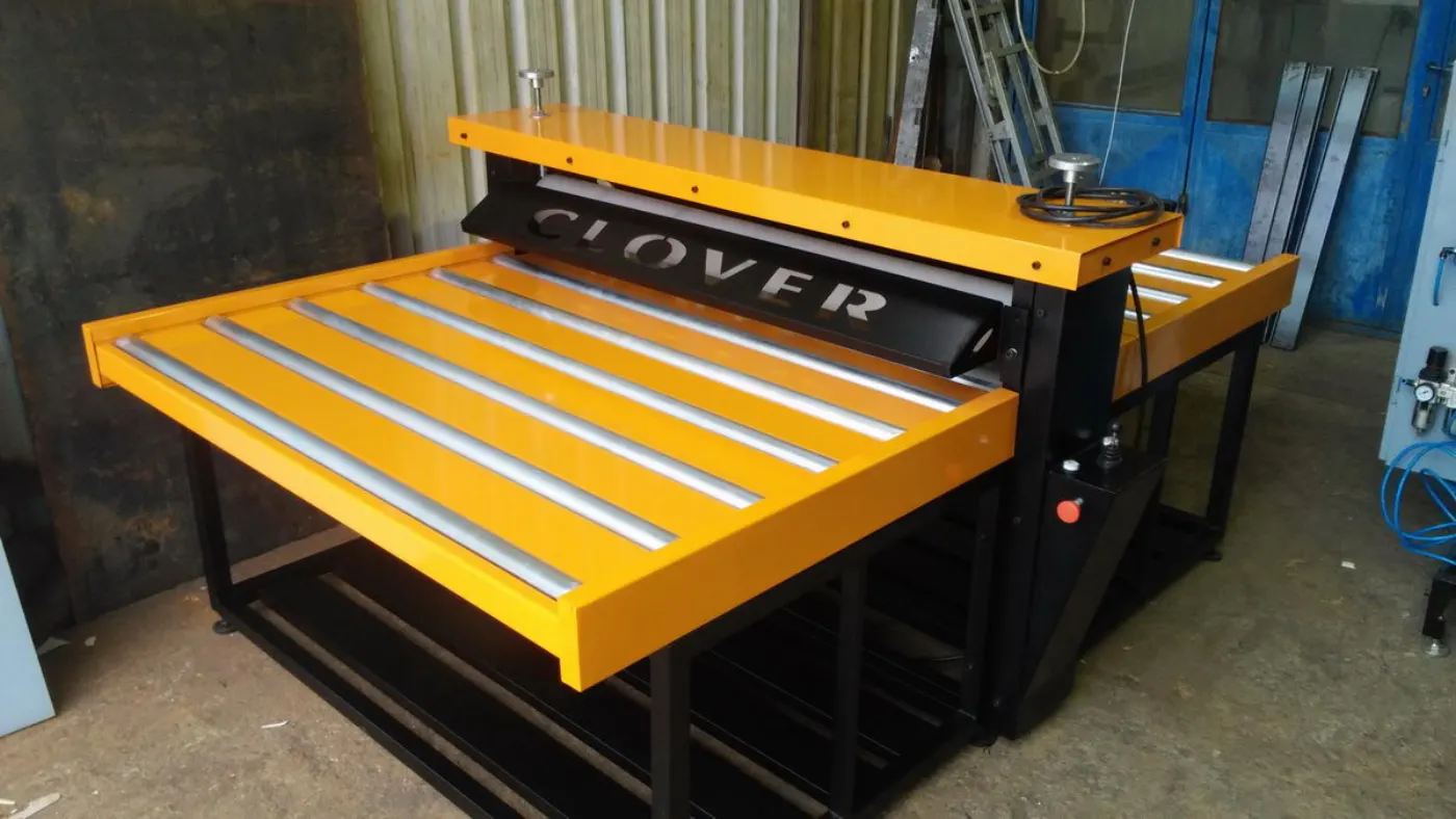 Rotary die-cutter for cardboard, yellow work table with rollers